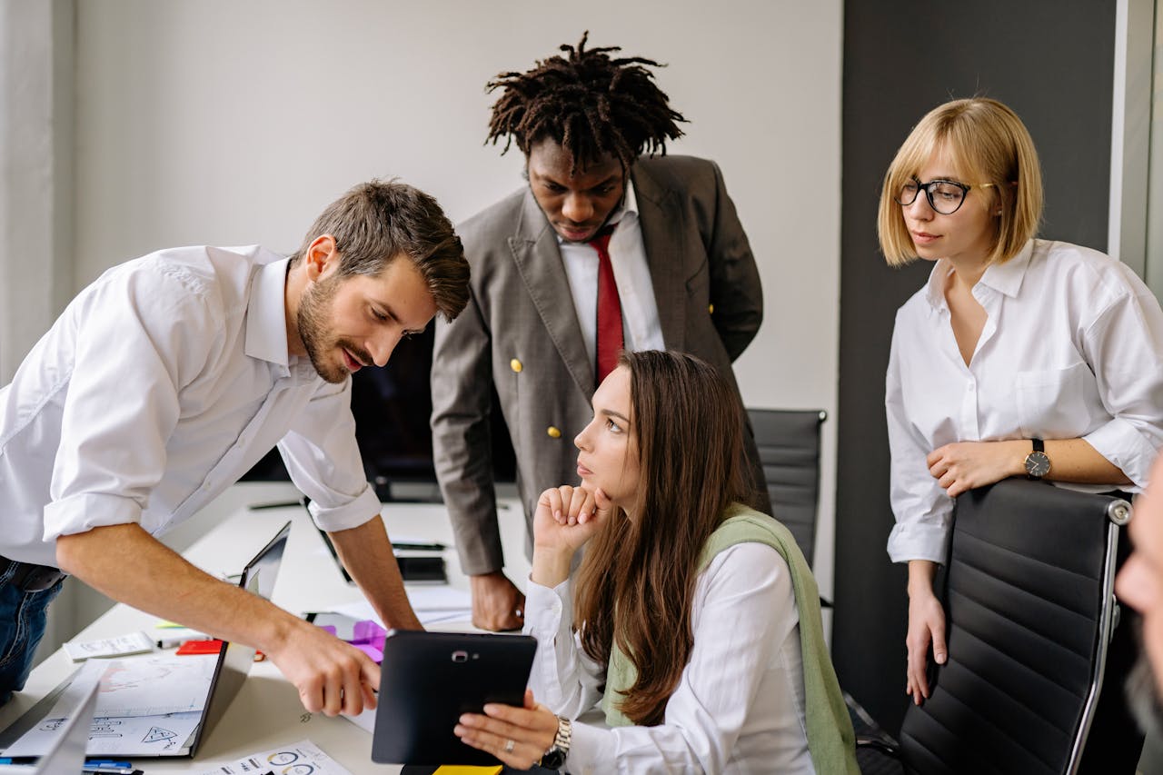 The Art of Drawing Readers In: Your attractive post title goes here A group of professionals engaging in a collaborative business meeting in a modern office.